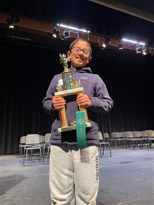 Boy holding a trophy